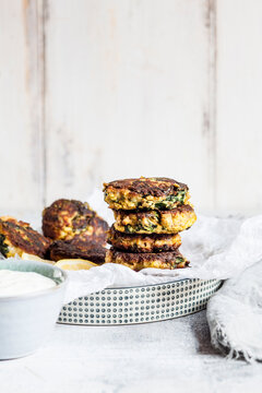 Stack of salmon fritters with spinach