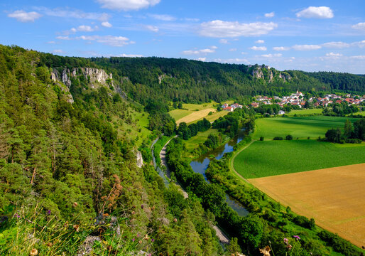 Germany, Bavaria, Kipfenberg, Drone view of river Altmuhl and Arnsberger Leite formation with village in background