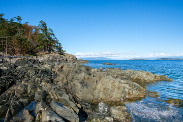 Fototapeta na wymiar Rocky shoreline of Moorecroft Regional Park, Strait of Georgia, Vancouver Island