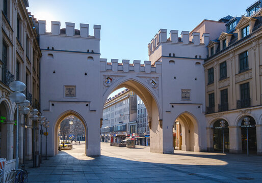 Germany, Bavaria, Munich, Medieval Karlstor gate and empty Neuhauser Strasse