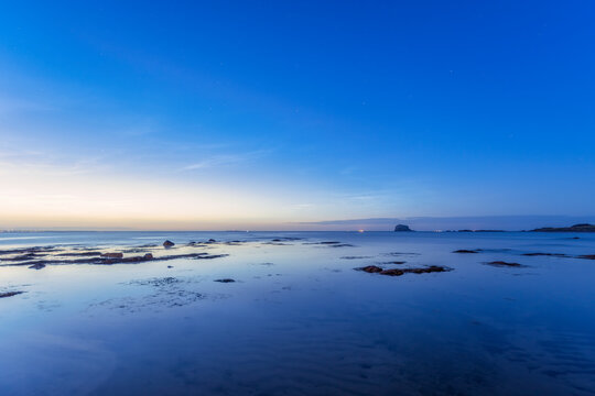 UK, Scotland, North Berwick, Shore of Firth of Forth at blue dusk