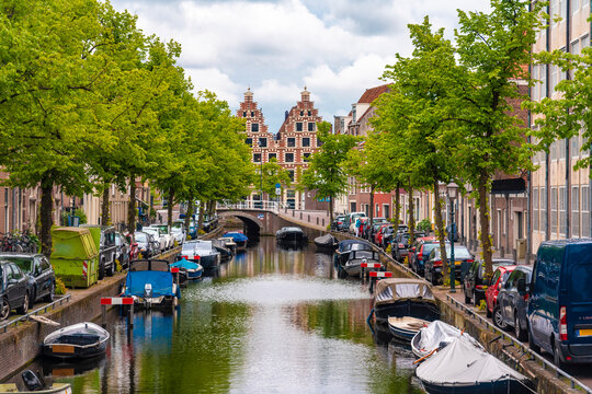 Netherlands, North Holland, Haarlem, Boats moored along city canal
