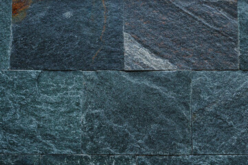 The rough surface of a wild decorative stone. Textured background. Blank for design. Underlay or...