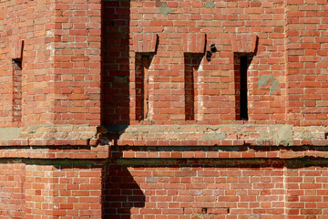 Rough brick wall with architectural elements. Textured background. Blank for design. Underlay or...