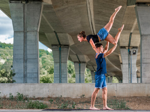 Young couple doing acrobatics