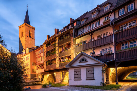 Germany, Erfurt, Karmerbrucke and St Giles church illuminated at dusk