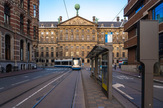 Netherlands, North Holland, Amsterdam, Train passing&Ocirc;&oslash;&Omega;Royal Palace of Amsterdam