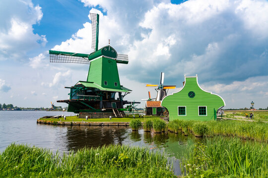 Netherlands, North Holland, Amsterdam, Historic windmill on bank of Zaan river