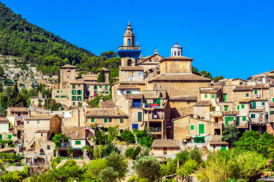 Buildings against clear blue sky during sunny day at Valldemossa, Mallorca, Spain, Europe