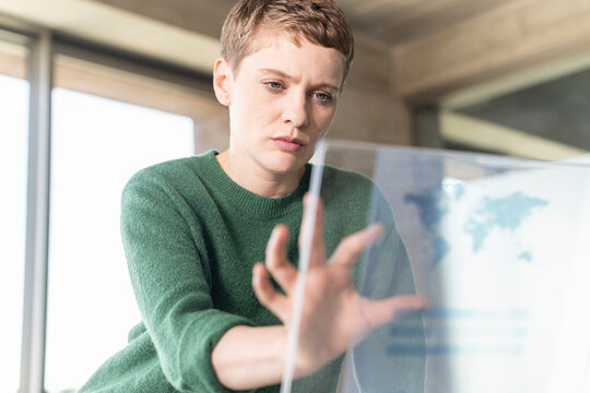 Businesswoman in office using virtual screen