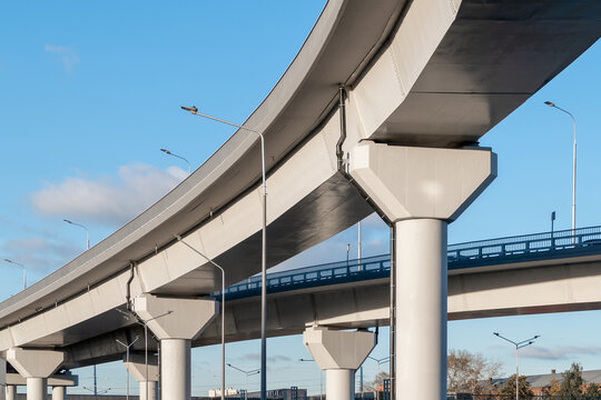 Automobile overpass on concrete supports. New road infrastructure. Preventing traffic jams