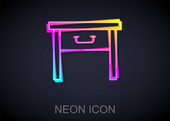 Glowing neon line Furniture nightstand icon isolated on black background. Vector