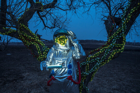 Spacewoman with a torch in the evening