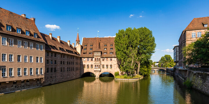 Germany, Bavaria, Nuremberg, Panorama of river Pegnitz and Holy Spirit Hospital