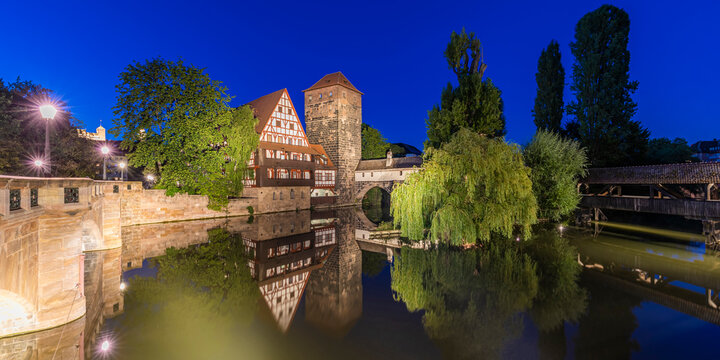 Germany, Bavaria, Nuremberg, Panorama of river Pegnitz, Weinstadel and Wasserturm at night