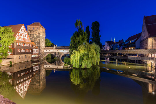 Germany, Bavaria, Nuremberg, Rver Pegnitz, Henkersteg, Weinstadel and Wasserturm at night