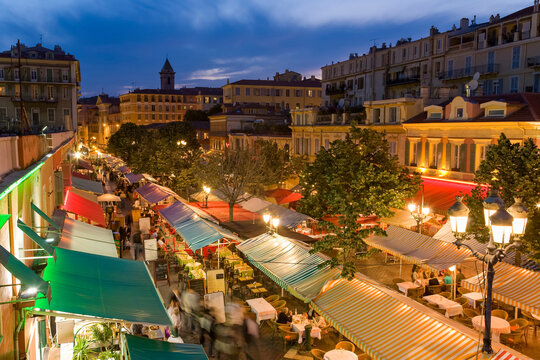France, Provence-Alpes-Cote dAzur, Nice, Restaurant canopies stretching along&Ocirc;&oslash;&Omega;Cours Saleya at dusk