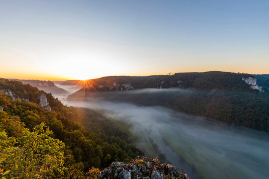 Germany, Baden-Wurttemberg, Scenic view of Danube Valley shrouded in fog at summer sunrise