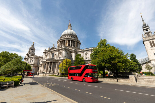 UK, London, St Paul's Cathedral and  red double decker bus on a sunny day