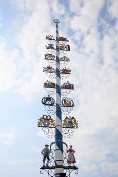 Tall maypole standing against sky