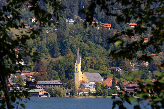 Germany, Bavaria, Schliersee, Saint Sixtus Church standing on shore of Lake Schliersee