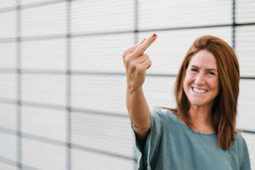 Female rebel giving the finger