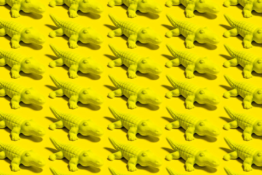 Pattern of rows of yellow crocodile figurines