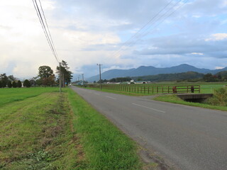 Fototapeta na wymiar A country road in Shizunai