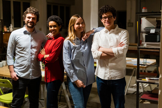Portrait of confident colleagues in office