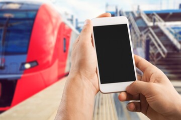 Traveler holds vaccine passport certificate, blank screen smartphone, travel during coronavirus pandemic .