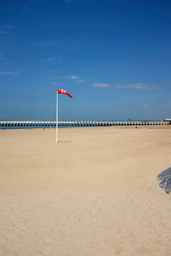 Belgium, Ostend - Windsock on beach with pier in background