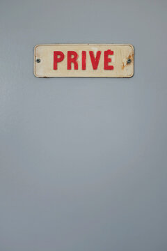 France, Brittany, Audierne, Retro private sign on gray surface
