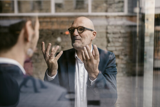 Portrait of senior and mid-adult businessman having a meeting