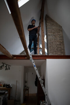 Architect working on construction sit of a loft conversion