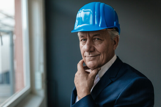 Portrait of a confident senior businessman wearing hard hat