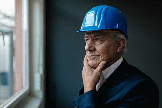 Portrait of a confident senior businessman wearing hard hat