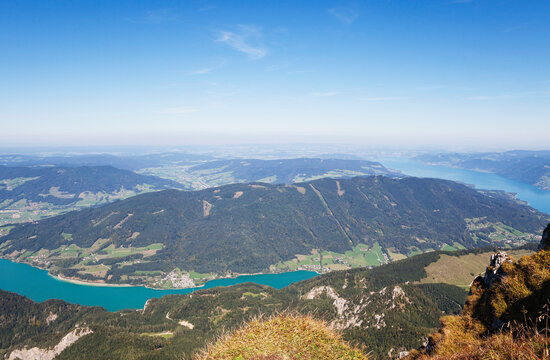 Idyllic shot of lake and mountains against blue sky