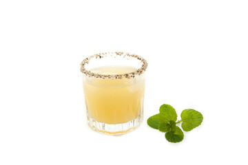 Traditional cocktail Mexican drink reserve tequila with lemon and chamomile frosted with salt prepared in a bar in Mexico