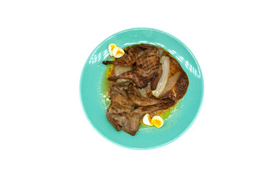 Egg garnishing quail stew with onion thigh and roasted animal wing isolated on white background protein in Mexico