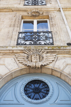 France, Gironde, Bordeaux, Low angle view of mascaron decorating entrance of residential building