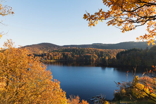 Germany, North Rhine-Westphalia, Long exposure of Obersee lake in autumn