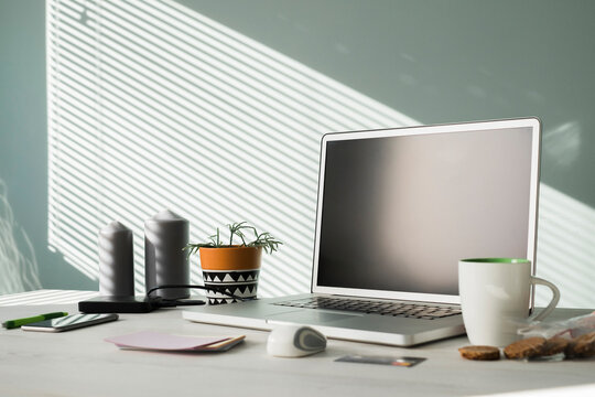 Opened laptop on an office desk