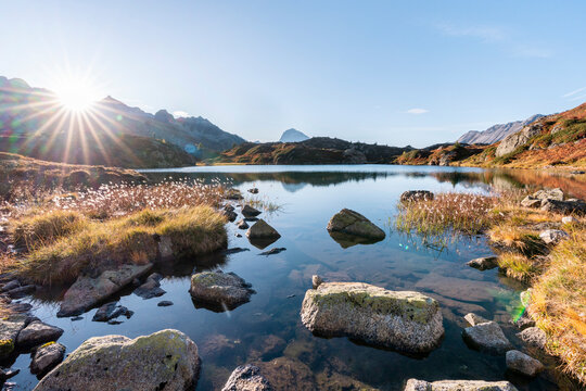 Switzerland, Canton of Grisons, Crap Alv Lajets lake at autumn sunset
