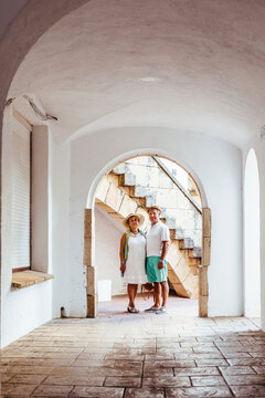 Senior tourist couple in a village, El Roc de Sant Gaieta, Spain