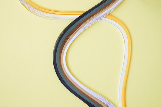 High angle view of various quilling papers on beige background
