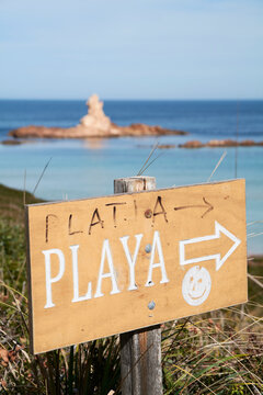 Close-up of beach sign against sky during sunny day, Menorca, Spain