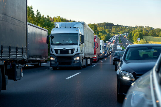 Rescue lane, cars and trucks during traffic jam in the evening, Germany