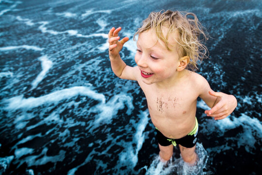 Boy playing at the seafront, Adeje, Tenerife, Canarian Islands, Spain