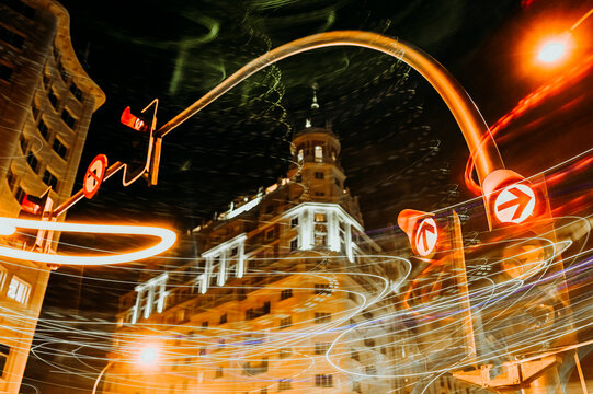 Traffic lights at luminous night in Madrid city, long exposure