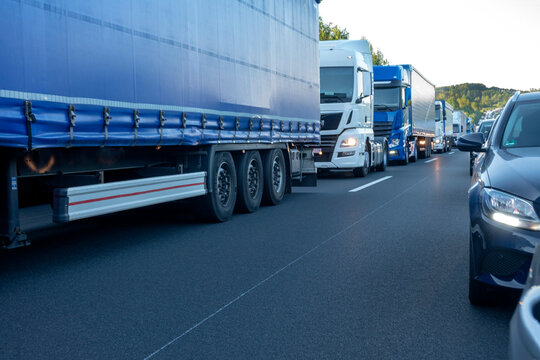 Rescue lane, cars and trucks during traffic jam in the evening, Germany